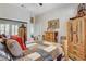 Bedroom showcasing rustic wooden furniture and a cozy atmosphere at 3120 Darby Falls Dr, Las Vegas, NV 89134
