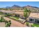 Beautiful single story home with manicured lawn and landscaping against mountain backdrop at 3120 Darby Falls Dr, Las Vegas, NV 89134