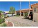Charming home featuring a tiled roof, palm trees, and a beautifully landscaped front yard at 3120 Darby Falls Dr, Las Vegas, NV 89134