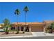 Traditional single-story home showcasing a two-car garage, tile roof, and well-maintained front yard at 3120 Darby Falls Dr, Las Vegas, NV 89134