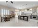 Bright, open kitchen with large island seating, stainless appliances, and a dining area at 3120 Darby Falls Dr, Las Vegas, NV 89134