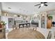 Bright open kitchen with stainless steel appliances, an island with seating, and modern white cabinets at 3120 Darby Falls Dr, Las Vegas, NV 89134