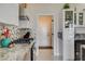 Well-lit kitchen with granite counters, stainless steel appliances, and modern cabinetry at 3120 Darby Falls Dr, Las Vegas, NV 89134