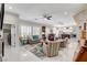 Spacious open-concept living area with multiple seating areas and views into the modern kitchen at 3120 Darby Falls Dr, Las Vegas, NV 89134