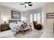 Serene main bedroom with a seating area, large windows, and a calming color palette at 3120 Darby Falls Dr, Las Vegas, NV 89134