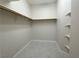 Organized walk-in closet with shelving and ample storage space, perfect for wardrobe organization at 33 Hatten Bay St, Henderson, NV 89012