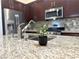 Close up view of kitchen featuring stainless steel appliances and granite countertops at 33 Hatten Bay St, Henderson, NV 89012