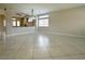 Spacious living area featuring tile floors, neutral walls and a modern light fixture at 33 Hatten Bay St, Henderson, NV 89012