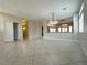 Open-concept living area featuring tile floors, neutral walls and a pass-through to the kitchen at 33 Hatten Bay St, Henderson, NV 89012