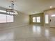 Bright living area with tile floors, neutral walls and natural light from multiple windows at 33 Hatten Bay St, Henderson, NV 89012
