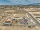 Aerial view of a secluded desert property on a large lot with storage at 3301 Underbrush Ave, Pahrump, NV 89048