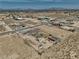 Aerial view of a desert property with a large lot, including storage and mountain views in the distance at 3301 Underbrush Ave, Pahrump, NV 89048