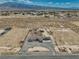 Beautiful aerial view showcasing a property with desert landscape, mountain views, and ample land at 3301 Underbrush Ave, Pahrump, NV 89048