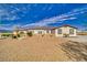 Cozy backyard featuring a dining area, garden area with planters and drought resistant landscaping at 3301 Underbrush Ave, Pahrump, NV 89048