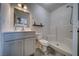 Clean and modern bathroom featuring a white vanity, toilet, and walk-in shower at 3301 Underbrush Ave, Pahrump, NV 89048