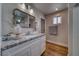 Well-lit bathroom with a granite-topped vanity, vessel sink, and a shower is as functional as it is fashionable at 3301 Underbrush Ave, Pahrump, NV 89048