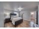 Comfortable bedroom featuring stylish flooring, a ceiling fan, and bathed in natural light from the window at 3301 Underbrush Ave, Pahrump, NV 89048