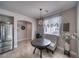 Charming breakfast nook adjacent to the kitchen, features a round table and natural light at 3301 Underbrush Ave, Pahrump, NV 89048