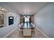 Formal dining room with modern chandelier and a dark wood table set for ten at 3301 Underbrush Ave, Pahrump, NV 89048