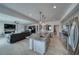 Gourmet kitchen with stainless steel appliances, granite countertops, and an island with a sink at 3301 Underbrush Ave, Pahrump, NV 89048