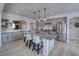 Contemporary kitchen featuring stainless appliances, a stylish island, and sleek gray cabinetry at 3301 Underbrush Ave, Pahrump, NV 89048