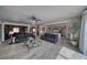 Open-concept living room boasts neutral tones, natural light, and a seamless flow into the kitchen area at 3301 Underbrush Ave, Pahrump, NV 89048