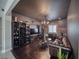 Comfortable living room area, featuring a tufted leather sofa and stylish wine storage at 3301 Underbrush Ave, Pahrump, NV 89048