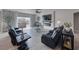 Comfortable living room featuring tile flooring and sliding glass doors to the backyard at 3301 Underbrush Ave, Pahrump, NV 89048