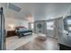 Spacious main bedroom featuring a decorative chandelier, wood floors, and seating area at 3301 Underbrush Ave, Pahrump, NV 89048