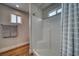 A clean, bright shower with white subway tile, built-in seat and hand towels offers a spa-like experience at 3301 Underbrush Ave, Pahrump, NV 89048
