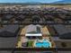 Aerial view of a home featuring a backyard oasis with a pool, patio, shed, and well-kept landscaping at 3568 E Malheur Ave, Pahrump, NV 89061