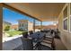 Relaxing covered patio area featuring an outdoor dining set, perfect for entertaining or enjoying Gathering meals at 3568 E Malheur Ave, Pahrump, NV 89061