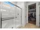 Bathroom showcasing a glass-enclosed shower, bright lighting, and a spacious walk-in closet at 3568 E Malheur Ave, Pahrump, NV 89061
