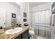Well-lit bathroom with a granite vanity and shower-tub combination, creating a functional and stylish space at 3568 E Malheur Ave, Pahrump, NV 89061