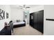 Serene bedroom featuring a daybed, wardrobe, and minimalist decor, offering a peaceful retreat at 3568 E Malheur Ave, Pahrump, NV 89061