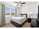 A cozy bedroom filled with natural light, complemented by neutral decor and comfortable furnishings at 3568 E Malheur Ave, Pahrump, NV 89061