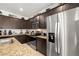 Well-equipped kitchen with stainless steel appliances, granite countertops, and ample cabinet space at 3568 E Malheur Ave, Pahrump, NV 89061