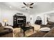 Inviting living room featuring a cozy brown sofa, stylish decor, and a ceiling fan for comfortable living at 3568 E Malheur Ave, Pahrump, NV 89061