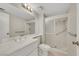 Bright bathroom featuring a single vanity and walk in shower with grab bars at 3746 E Harmon Ave, Las Vegas, NV 89121