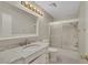 Bathroom features a single sink vanity with a marble countertop and a bathtub with sliding glass doors at 3746 E Harmon Ave, Las Vegas, NV 89121