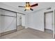 Bedroom features carpet, ceiling fan, and mirrored closet at 3746 E Harmon Ave, Las Vegas, NV 89121