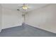 Bright bedroom features neutral carpet, a ceiling fan, and ample natural light at 3746 E Harmon Ave, Las Vegas, NV 89121