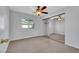 Bedroom featuring plush carpet, a window and mirrored closet doors at 3746 E Harmon Ave, Las Vegas, NV 89121