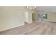 Open-concept dining room featuring carpet flooring and white walls at 3746 E Harmon Ave, Las Vegas, NV 89121
