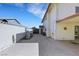 Long concrete driveway leading to a backyard gate between a home and a decorative concrete block wall at 3746 E Harmon Ave, Las Vegas, NV 89121