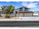 Two-story home featuring a two-car garage and solar panels at 3746 E Harmon Ave, Las Vegas, NV 89121