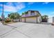 Two-story home with a spacious driveway and a two-car garage at 3746 E Harmon Ave, Las Vegas, NV 89121