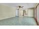 Living room featuring tile flooring, ceiling fan, and doors to the exterior at 3746 E Harmon Ave, Las Vegas, NV 89121