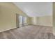 Spacious living room with neutral carpeting and large windows at 3746 E Harmon Ave, Las Vegas, NV 89121