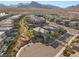 An aerial view captures a neatly planned community nestled in the desert with stunning mountain views at 389 Red Feather Peak Ct, Las Vegas, NV 89138